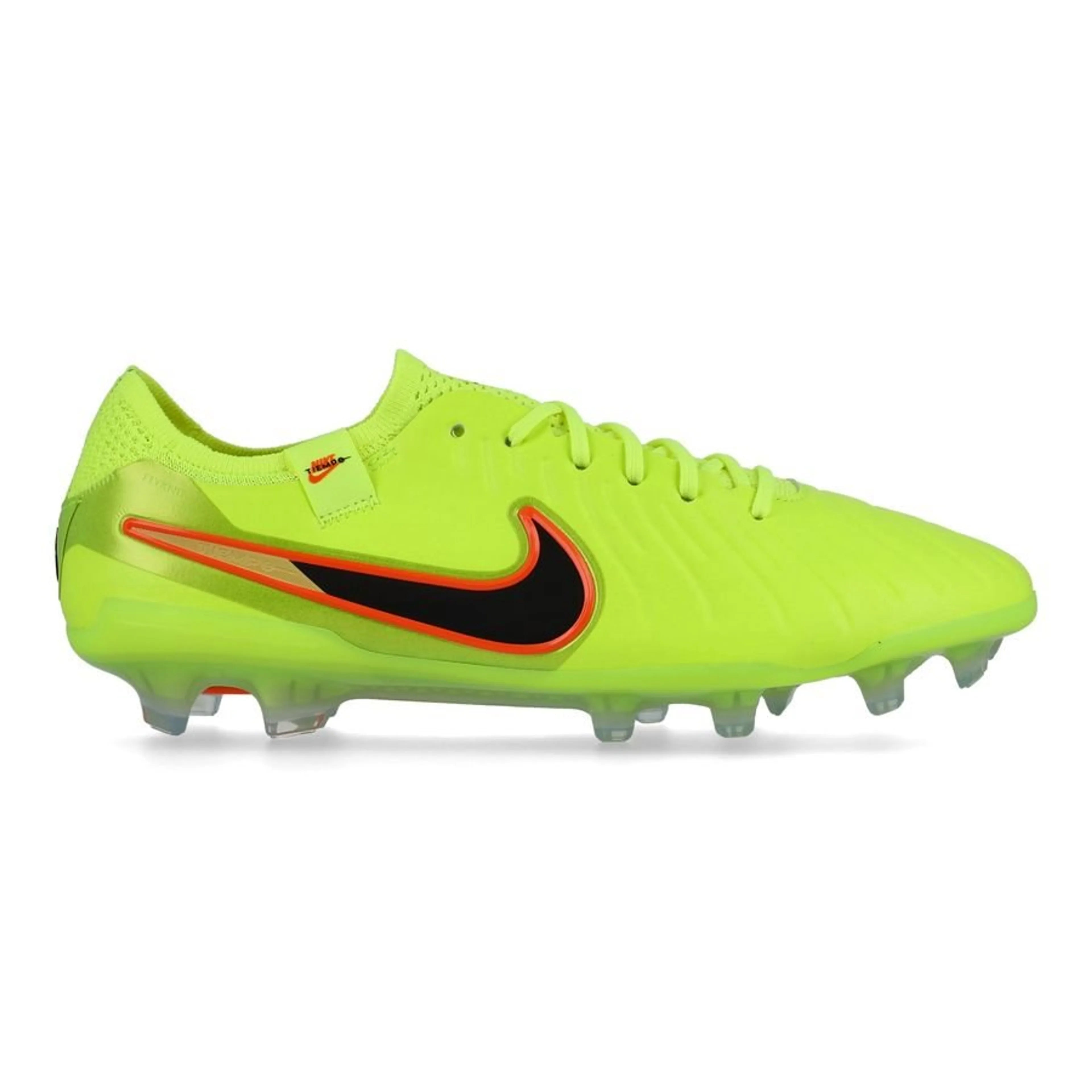 Bright green soccer cleat with black swoosh logo on a white background