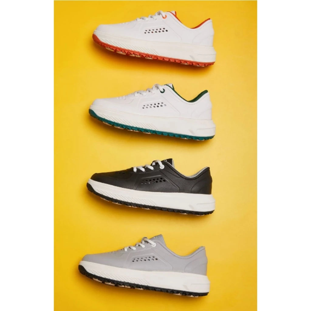 Four pairs of golf shoes in white, black, and gray on a yellow background with coloured accents